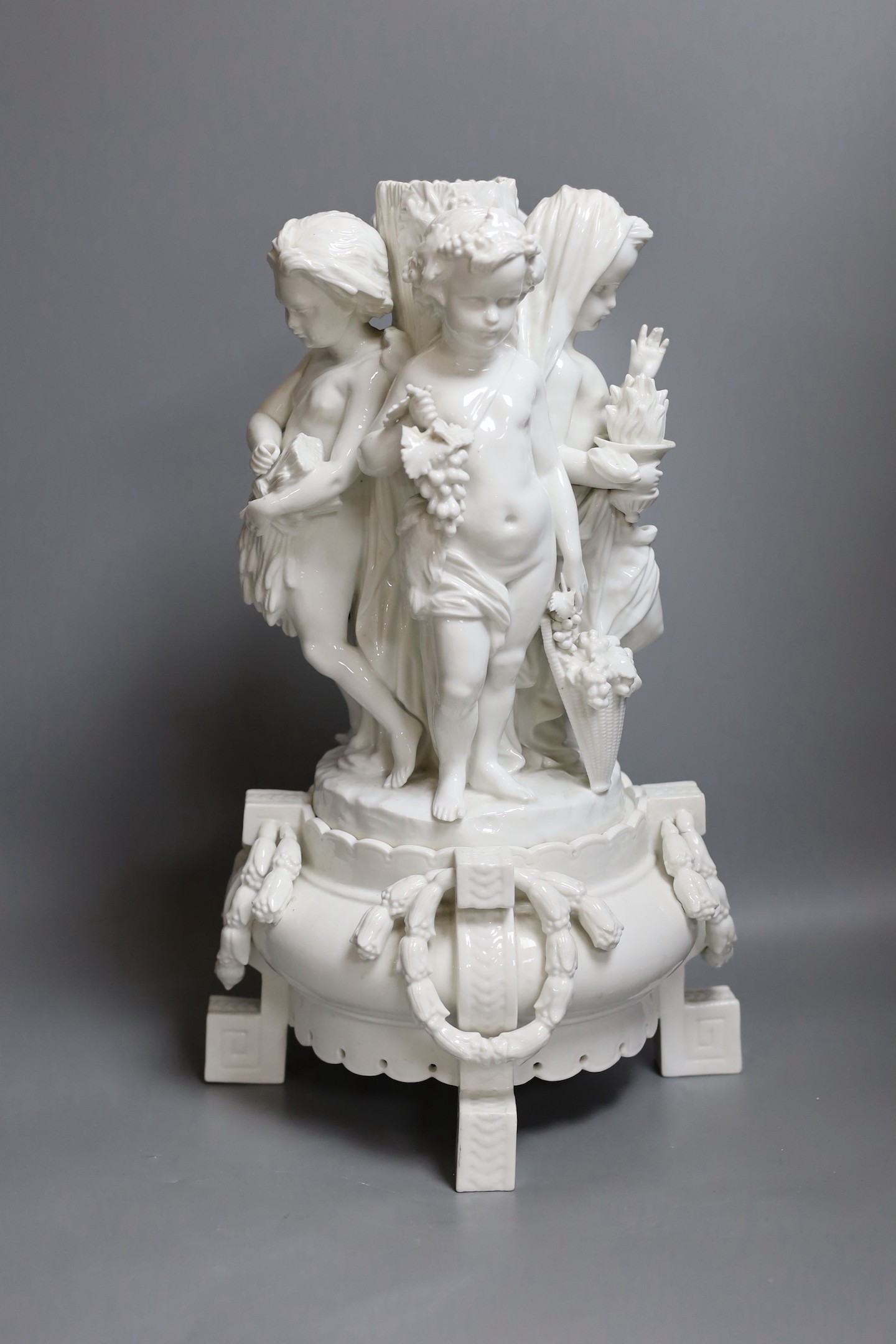 A Meissen style figural centrepiece, stem emblematic of the four seasons, 43 cms high